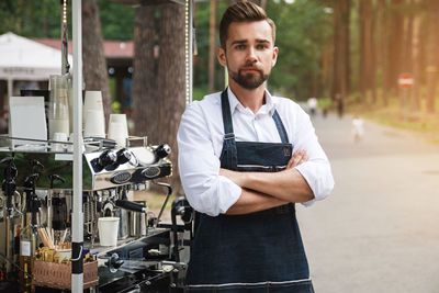 Portrait of young man standing outdoors