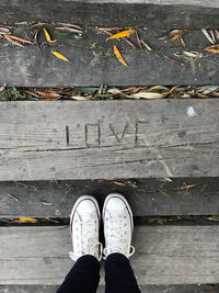 Look from above, love engraved in wood floor