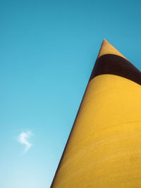 Low angle view of building against blue sky