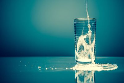 Close-up of blue water on table