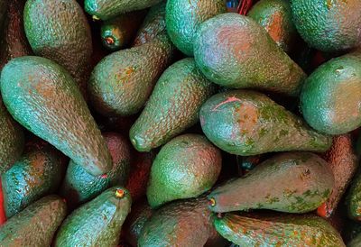 Full frame shot of avocados for sale at market