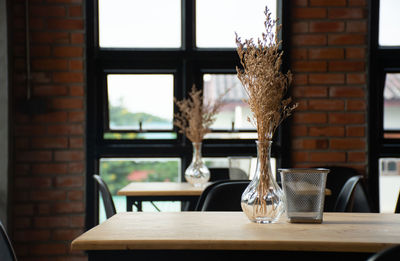 Plants in vase on tables at restaurant