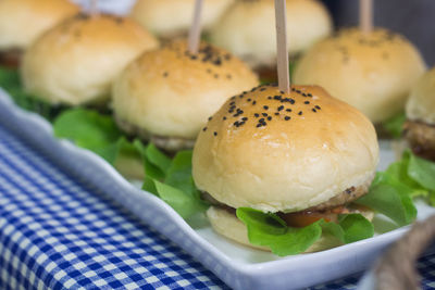 Close-up of burgers served on table