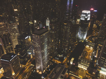 Aerial view of illuminated buildings in city at night