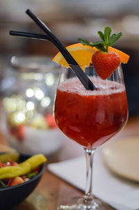 Close-up of red fruit on table