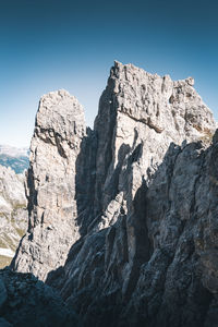 Low angle view of rock formations against sky