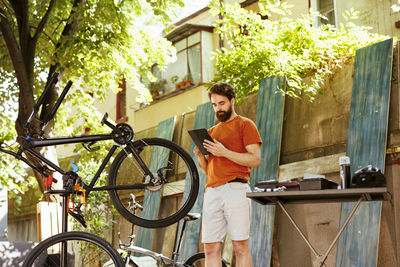 Side view of man using mobile phone