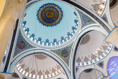 Low angle view of ceiling with ornamentation and architectural details camlica mosque in turkey