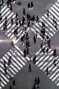 High angle view of people crossing road