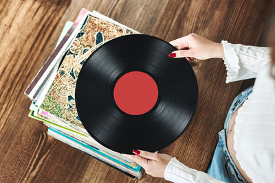 Playing vinyl records. listening to music from vinyl record. retro vintage style. music passion