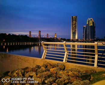 View of illuminated city at dusk