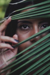 Close-up portrait of young woman with blue eyes