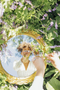 Midsection of woman holding bouquet