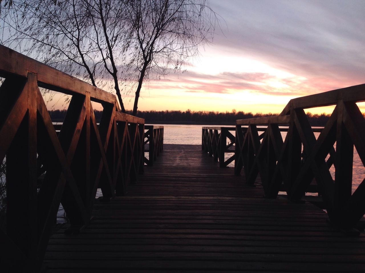 sky, railing, water, sea, wood - material, sunset, nature, outdoors, beauty in nature, tranquility, tranquil scene, scenics, idyllic, pier, no people, beach, cloud - sky, the way forward, vacations, day, tree, wood paneling