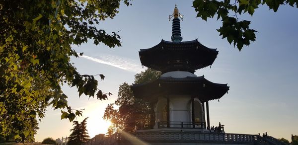 Low angle view of silhouette building against sky during sunset