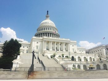 Capitol building against sky in city