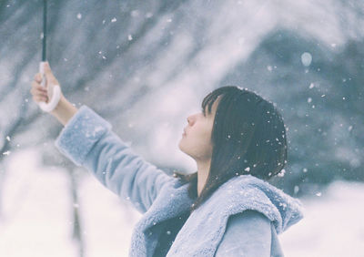 Portrait of woman in snow