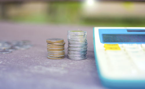 Close-up of coins on table