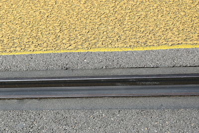 High angle view of railroad tracks on road