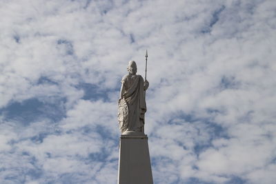 Low angle view of statue against cloudy sky