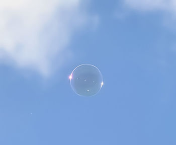 Low angle view of moon against sky