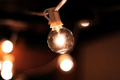 Close-up of illuminated light bulb