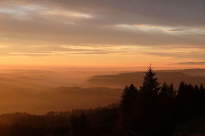 Scenic view of silhouette landscape against sky during sunset