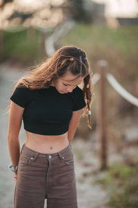 Young woman standing outdoors