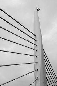 Low angle view of bridge and building against sky