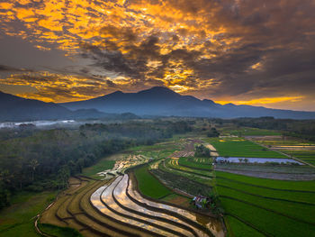 Scenic view of landscape against sky during sunset