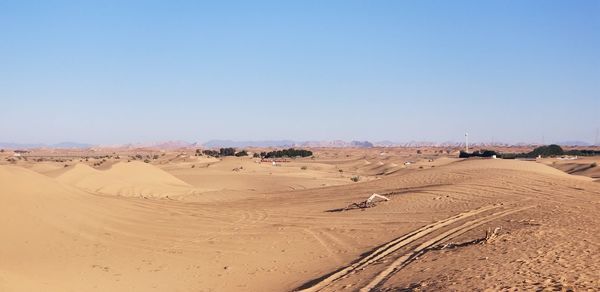 Panoramic view of desert against clear sky