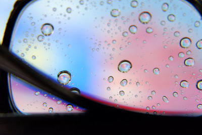 Close-up of raindrops on glass window