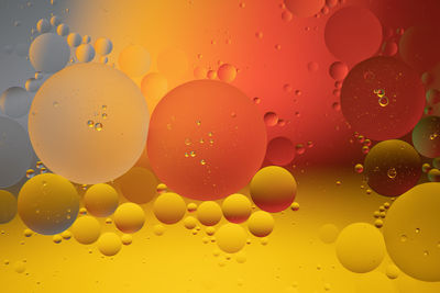 Full frame shot of water drops on orange