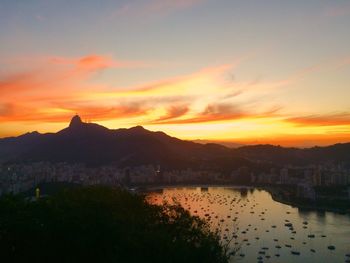 Scenic view of river at sunset