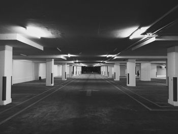 Illuminated underground walkway at night