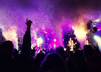 Rear view of people enjoying music concert