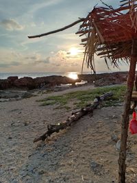 Scenic view of beach against sky during sunset