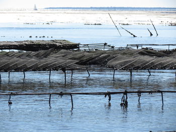 Scenic view of fishing nets at sea