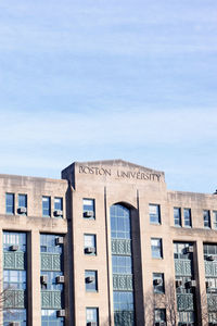 Low angle view of building against cloudy sky