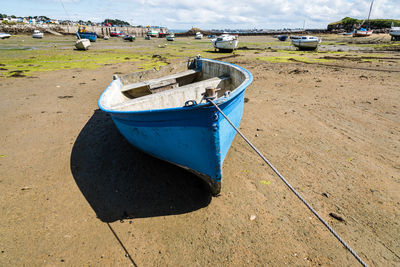 Stranded ships at low tide in the harbour of the island of batz a sunny day of summer