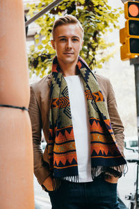 Portrait of young man standing outdoors