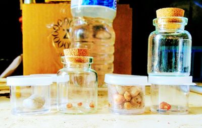 Close-up of bottles in jar