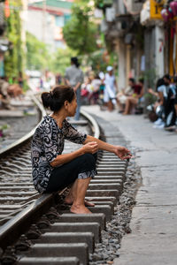 Full length of woman on railroad track