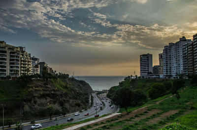 Panoramic view of buildings and sea against sky during sunset