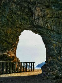 Scenic view of sea seen through cave