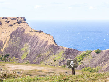 Scenic view of sea and mountains against sky