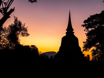 Silhouette of temple against sky during sunset