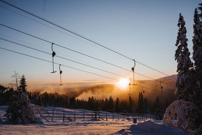 View of ski lift at sunset