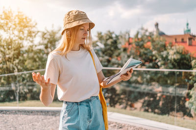 Portrait of young woman using mobile phone