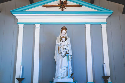 Low angle view of statue against building